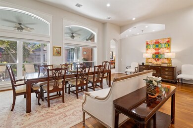 Another view of the dining room with a customized wall of windows completely trimmed out to showcase craftsmanship overlooking the backyard.