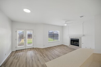 Unfurnished living room with light wood-type floo