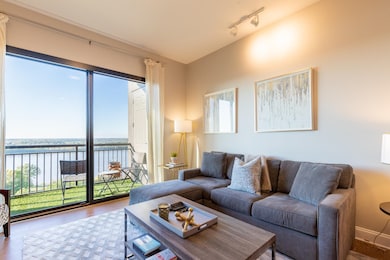 Living room with hardwood / wood-style floors, a w