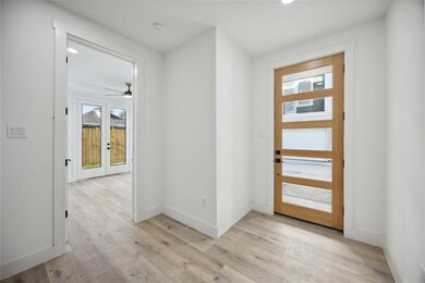 Welcoming entryway features a contemporary front d
