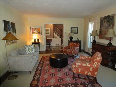 Good-looking living room with entrance hall beyond