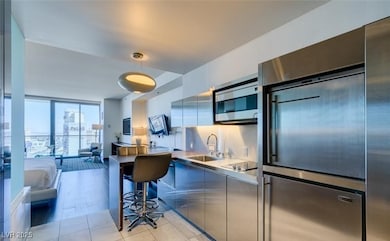 Kitchen featuring tasteful backsplash, built in ap