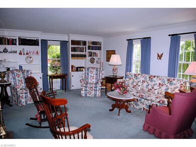 LARGE LIVING ROOM WITH WALL OF BUILT INS
