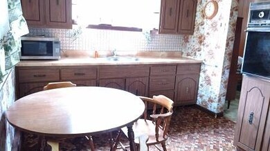 A view of the eat-in kitchen from the door leading