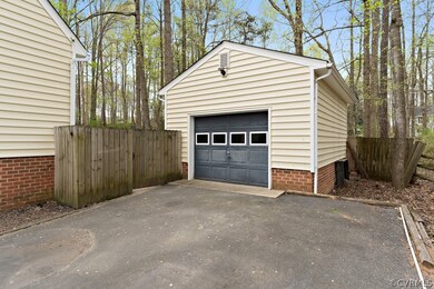 Detached 1 car garage with a pedestrian door.