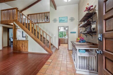 Entryway looking into living and kitchen