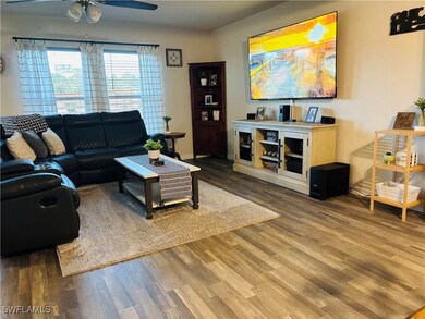 Living area featuring wood finished floors and a c