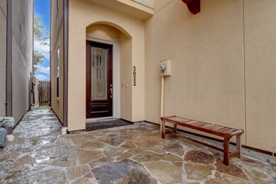 Entry Courtyard with Wrought Iron gate with doorbe