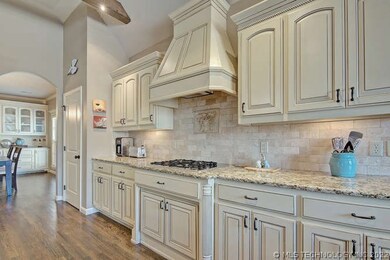 Beautiful granite, hardwoods and pantry.