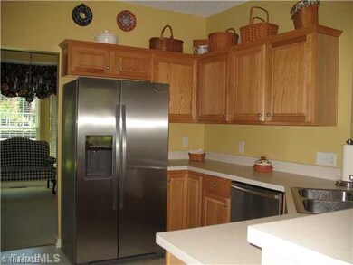 Kitchen. Walk Through Kitchen, view from Dinning room to Breakfast area.  Kitchen Appliances to Remain