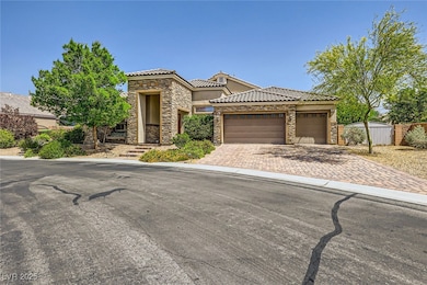 View of front of house featuring stone siding, dri
