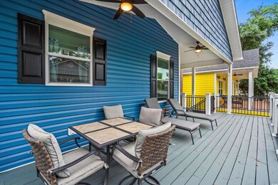 Deck with ceiling fan and outdoor dining area