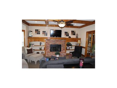 Family room with fireplace, built in bookshelves, 