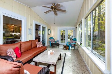 Welcoming 3 season sun room upon entering the home