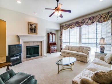 Large living room with gas starter fireplace and lots of natural light.