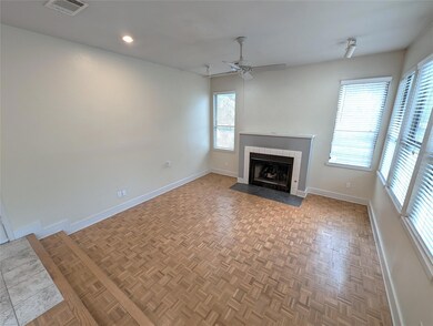 Unfurnished living room featuring baseboards, a c