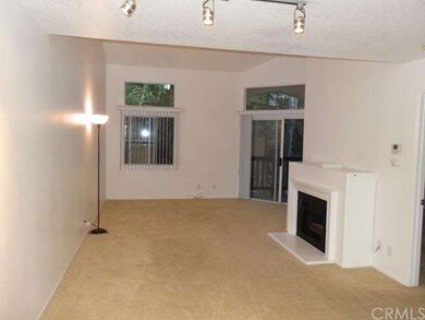 Spacious living room with fireplace. Cathedral cei