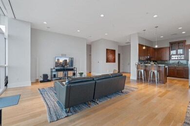 Living room with recessed lighting, light wood-ty