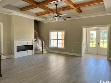 Unfurnished living room with beam ceiling, ceiling