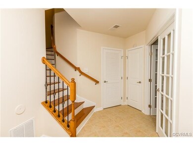 A welcoming foyer with tile floors.  The French do