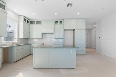 The kitchen is a chef’s dream, featuring Wolf/Subz