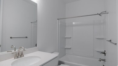 Full bath featuring shower / bathtub combination and vanity