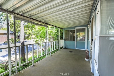 The front porch is a great area to relax or visit with friends and family. At the back of the porch there is a enclosed patio area.
