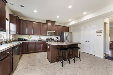 Large, eat in kitchen with island, pantry, & stain