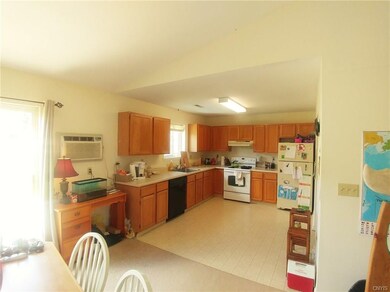Kitchen includes refrigerator, range, and dishwash