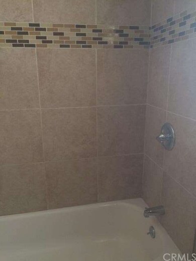 Beautifully tiled shower with bath tub