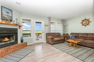 Living Room W/Wood Fireplace and Walkout To Water