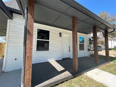 Entry view with updated roofline and inviting exterior.