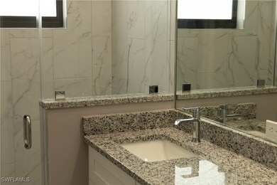 Bathroom with walk in shower and vanity