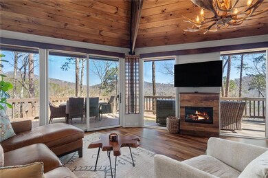 Great room featuring a tile fireplace, a notable c