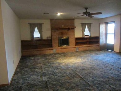 Den/Family/Great Room. Den with fireplace opens to