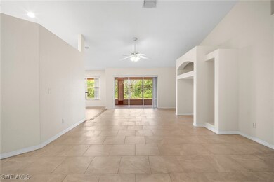 Unfurnished room featuring vaulted ceiling, ceilin