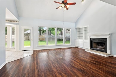 Living area has vaulted ceilings, vinyl plank floo