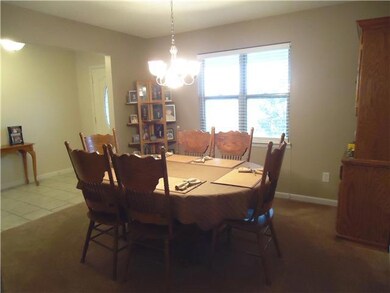 A formal dining room overlooks the front yard and is located to the left of the foyer and opens to the kitchen. 