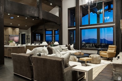 Common area featuring high vaulted ceiling, recessed lighting, and a wooden ceiling with exposed beams