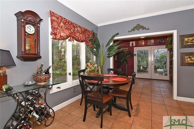 Breakfast area next to a library/sitting room. Til