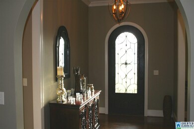 Large open entry well with iron door.  The upper h