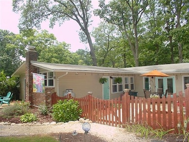 Fenced front garden and patio