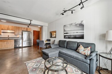 Living room with finished concrete flooring and t