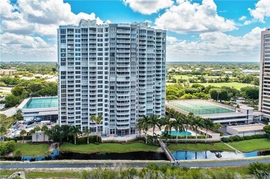 View of apartment building / complex featuring a water view