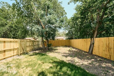 View of fenced backyard