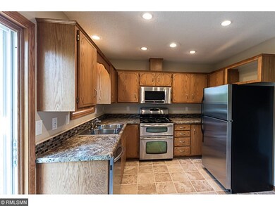 Newly updated kitchen with tile floors, backsplash