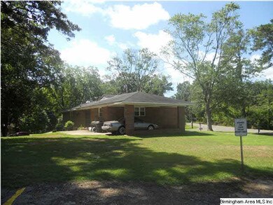 Rear View with patio and Side View of Carport