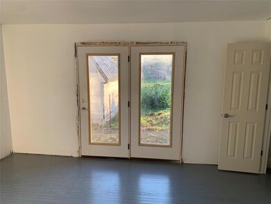 Doorway to outside featuring dark hardwood / wood-