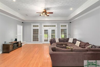 FOYER LEADS YOU TO THE GREAT ROOM WITH WOOD FLOORS
