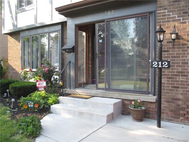 Welcome greeting with concrete walkway & enclosed 